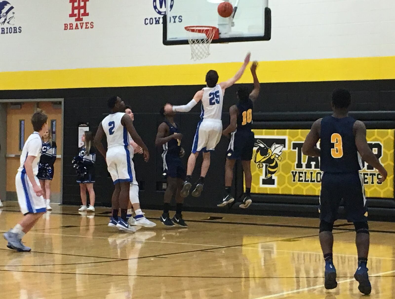 Cincinnati College Prep Academy’s Obie Houston (10) shoots over Middletown Christian’s Jonah Crawford (25) during Saturday night’s Division IV sectional final at Taylor. RICK CASSANO/STAFF