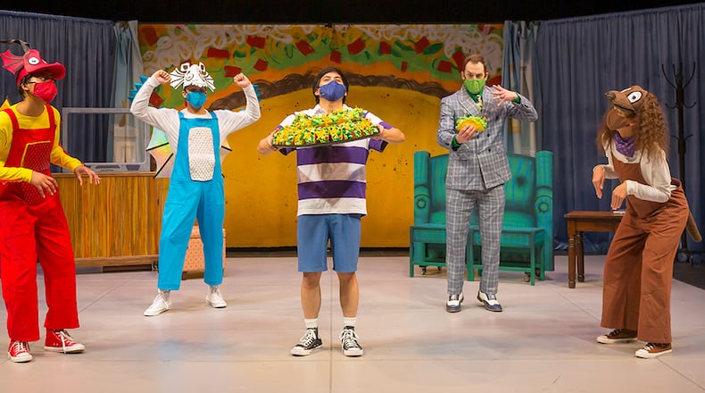 Photo courtesy of Cincinnati Playhouse in the Park/A.J. Baldwin (Red/Yellow Dragons), Kenneth Hamilton (Blue/White Dragons,) Joshua Carandang (Boy,) Phineas Clark (Man in Suit,) and Sydney E. Crutcher (Leroy, a dog.) Photo by Mikki Schaffner. CONTRIBUTED