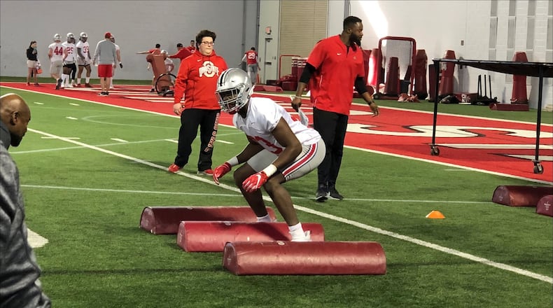 Freshman defensive end Zach Harrison takes part in a drill during the first day of Ohio State football’s spring practice Wednesday in Columbus. Marcus Hartman/STAFF