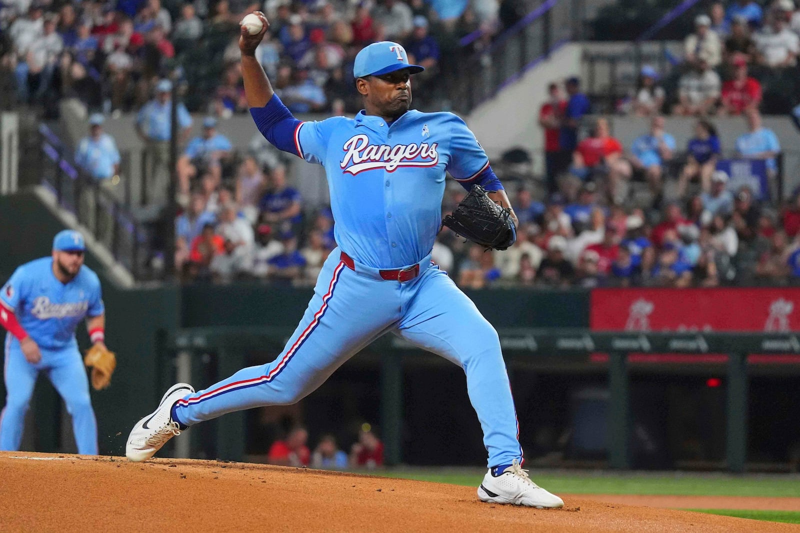 Texas Rangers starting pitcher Kumar Rocker throws during the first inning of a baseball game against the Chicago White Sox, Sunday, June 15, 2025, in Arlington, Texas. (AP Photo/LM Otero)