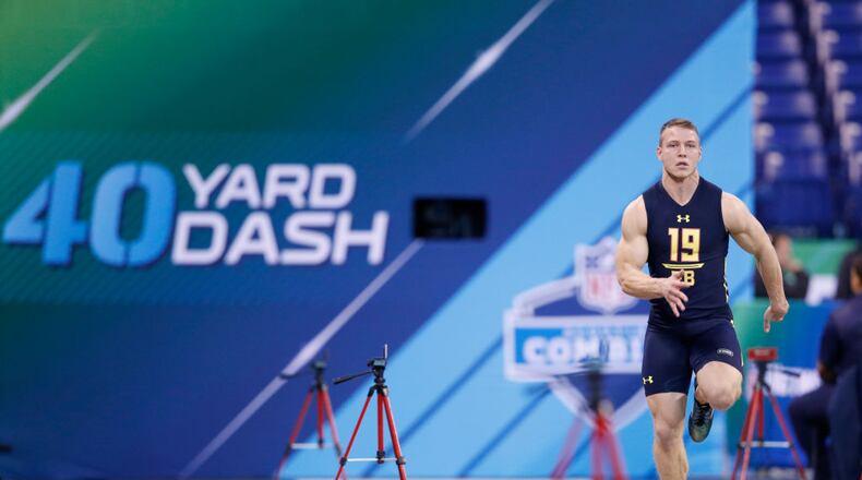 INDIANAPOLIS, IN - MARCH 03: Running back Christian McCaffrey of Stanford runs the 40-yard dash during the NFL Combine at Lucas Oil Stadium on March 3, 2017 in Indianapolis, Indiana. (Photo by Joe Robbins/Getty Images)