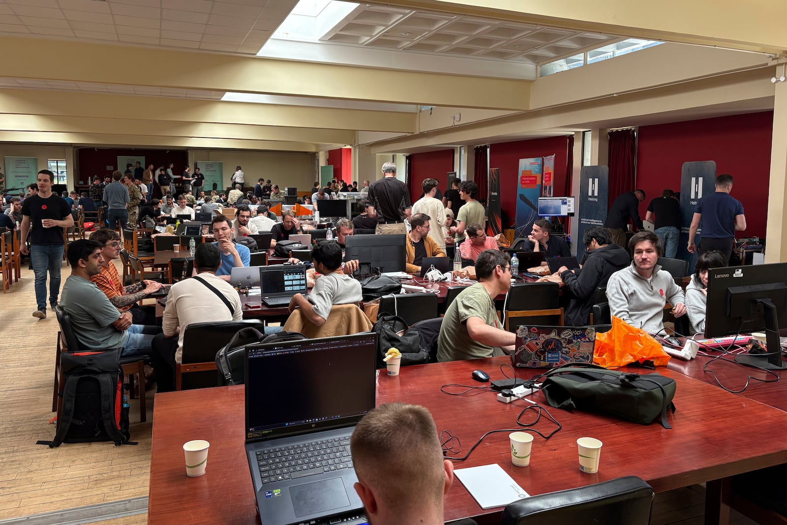 Participants gather for the London Defence Tech Hackathon, a weekend brainstorming solution for technical challenges, at the Royal Military Academy Sandhurst in Camberley, England, May 10, 2025. (AP Photos/Kelvin Chan)