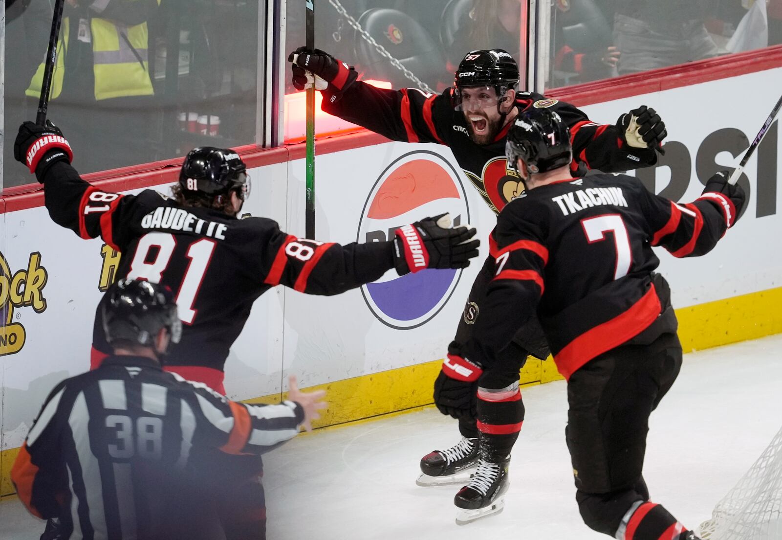 Ottawa Senators' David Perron (57) celebrates his goal with Adam Gaudette (81) and Brady Tkachuk (7) after scoring against the Toronto Maple Leafs during third period NHL playoff action in Ottawa, Saturday, April 26, 2025. (Adrian Wyld/The Canadian Press via AP)