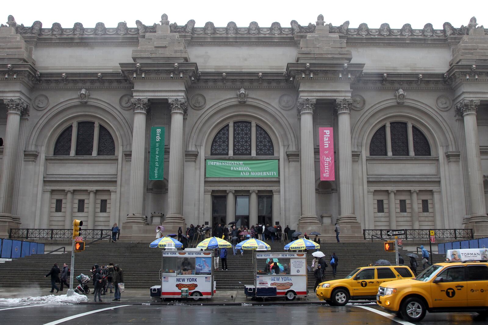 FILE - Taxis pass the Metropolitan Museum of Art on March 19, 2013, in New York. (AP Photo/Mary Altaffer, File)