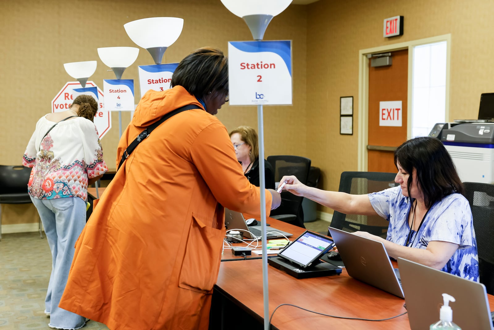 Poll workers check in voters for early voting Monday, April 29, 2025 at the Butler County Board of Elections. NICK GRAHAM/STAFF