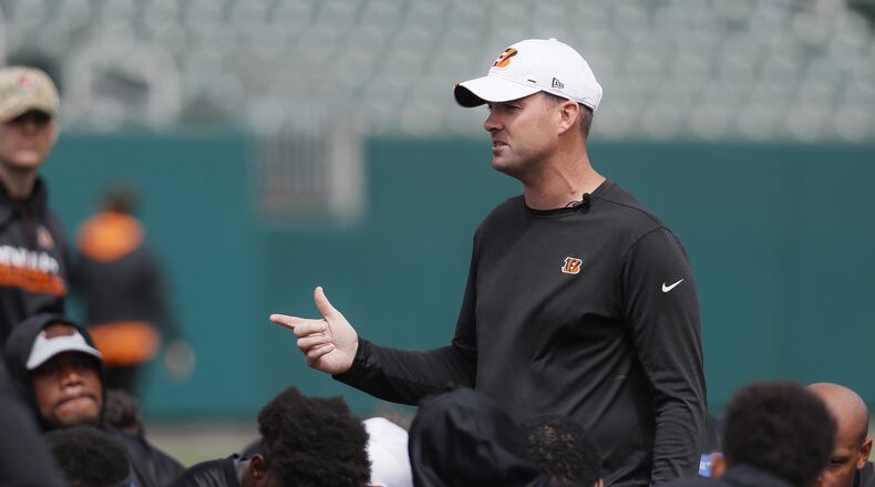 Cincinnati Bengals head coach Zac Taylor speaks to his players during NFL football practice, Thursday, June 13, 2019, in Cincinnati. (AP Photo/John Minchillo)