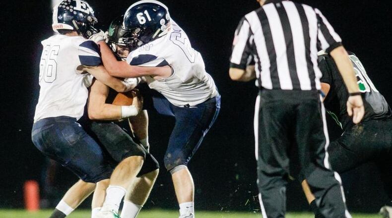 Edgewood’s Gavin Childers (66) and Caden Nance (61) put Harrison quarterback Connor Kinnett in a tough spot during last Friday night’s game at Harrison. Edgewood won 42-35 to remain unbeaten. NICK GRAHAM/STAFF
