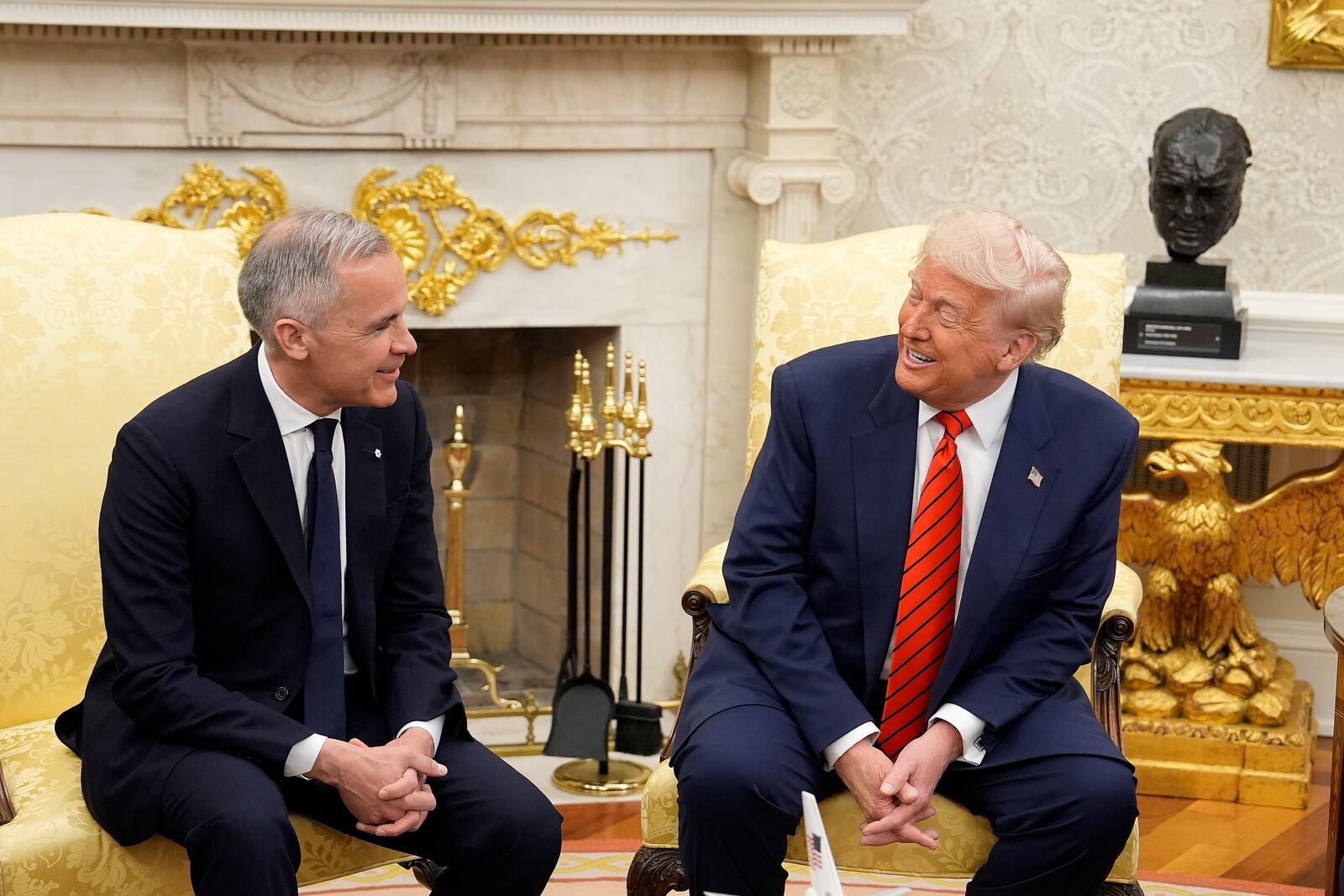 Canada Prime Minister Mark Carney and U.S. President Donald Trump engage in a meeting at the White House in Washington, Tuesday, May 6, 2025. (Adrian Wyld/The Canadian Press via AP)