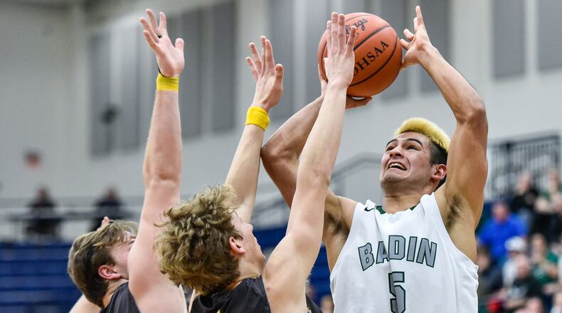 Badin’s Daunte DeCello puts up a shot over Alter’s Connor Meyer (4) and Derek Willits (23) during their Division II sectional semifinal Tuesday night at Fairmont’s Trent Arena. NICK GRAHAM/STAFF