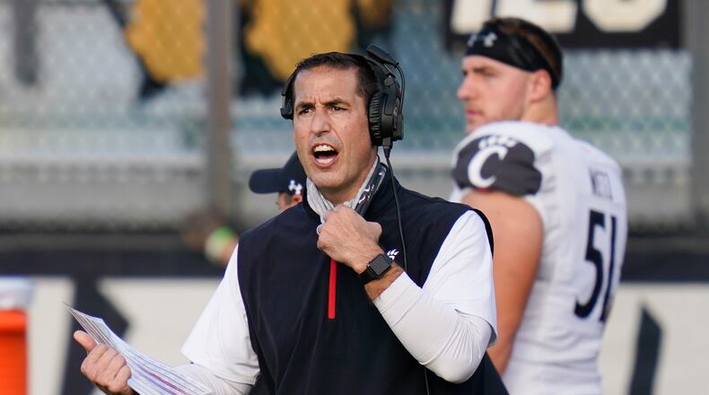 FILE - Cincinnati head coach Luke Fickell shouts instructions to his players during the first half of an NCAA college football game against Central Florida in Orlando, in this Saturday, Nov. 21, 2020, file photo. Fickell knew he might surprise some by suggesting No. 11 Georgia is the best team Cincinnati has faced in his four seasons as head coach. (AP Photo/John Raoux, File)