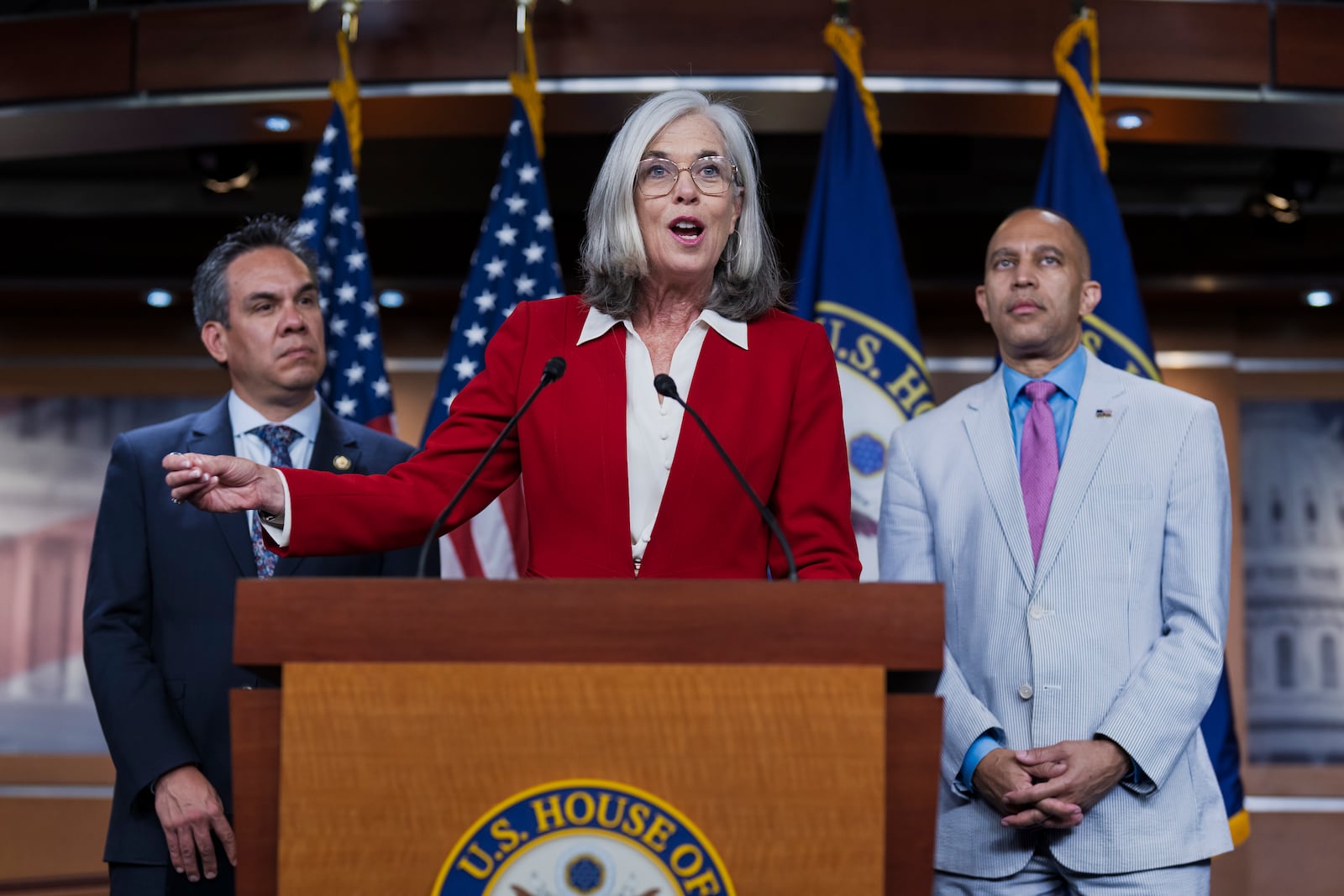 Rep. Katherine Clark, D-Mass., center, the House minority whip, flanked by Rep. Pete Aguilar, D-Calif., left, chair of the House Democratic Caucus, and House Minority Leader Hakeem Jeffries, D-N.Y., talks to reporters about the decision by Speaker Mike Johnson to leave Washington early as Republicans clash over the Jeffrey Epstein files, at the Capitol, Wednesday, July 23, 2025. (AP Photo/J. Scott Applewhite)