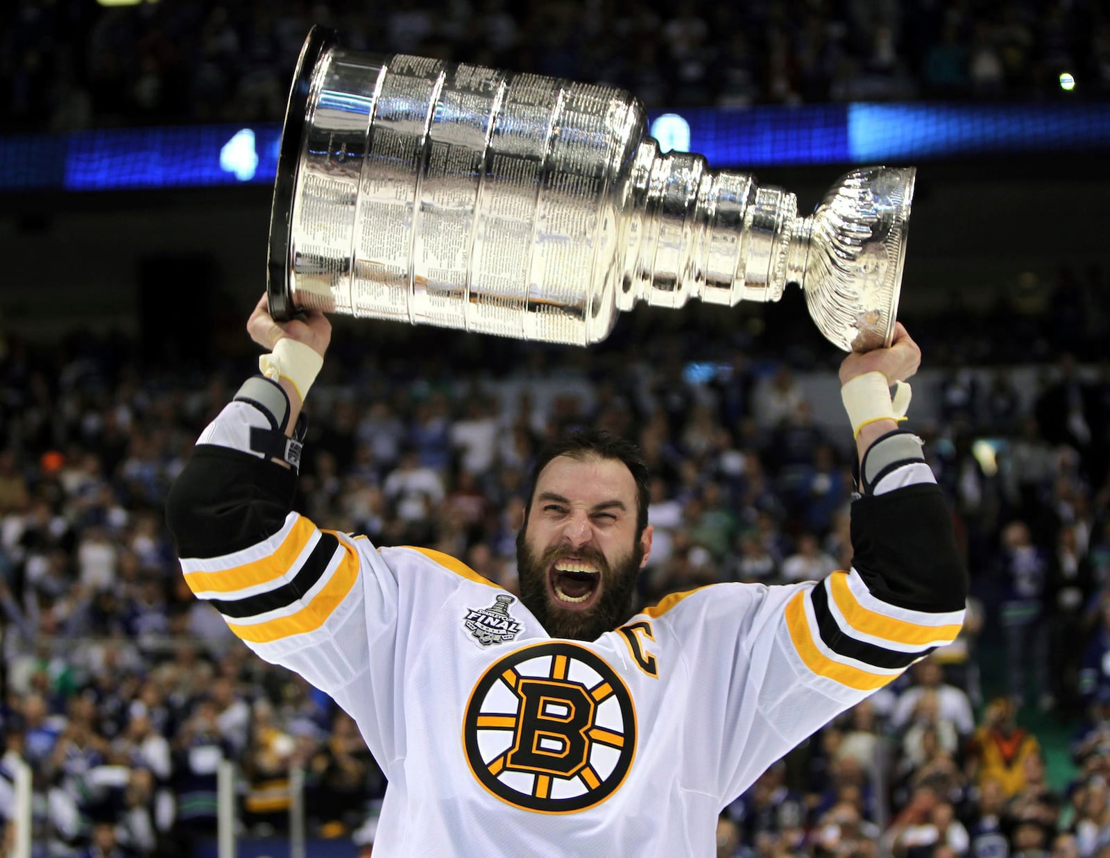 FILE - Boston Bruins' Zdeno Chara, of Slovakia, hoists the cup following the Bruins' 4-0 win over the Vancouver Canucks in Game 7 of the NHL hockey Stanley Cup Finals on June 15, 2011, in Vancouver, British Columbia, Canada. (Jonathan Hayward/The Canadian Press via AP)