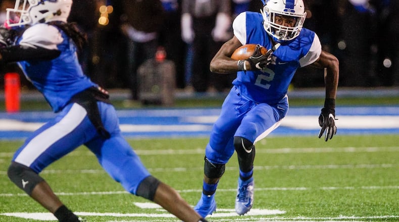Hamilton’s Kaleb Johnson carries the ball during their football game against Sycamore Friday, Oct. 25, 2019 at Virgil Schwarm Stadium at Hamilton High School in Hamilton. Hamilton won 14-7. NICK GRAHAM/STAFF