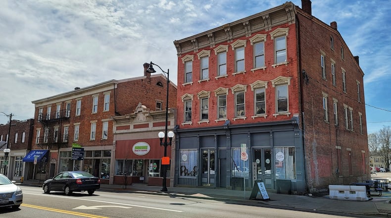 Eight apartments that will be upgraded to "upscale" units are planned for the 100 block of Main St., including at 117 Main, in the same building as the Petals & Wicks store. NICK GRAHAM/STAFF