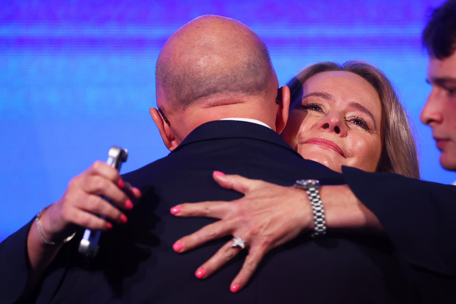 Australian Liberal Party leader Peter Dutton embraced by his wife Kirilly after making a concession speech following the general election in Brisbane, Australia, Saturday, May 3, 2025. (AP Photo/Pat Hoelscher)