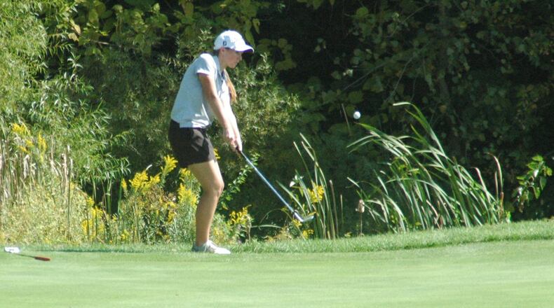 Lakota East’s Grace Honigford chips onto the 18th green Monday during the Division I sectional girls golf tournament at Walden Ponds Golf Club in Fairfield Township. RICK CASSANO/STAFF