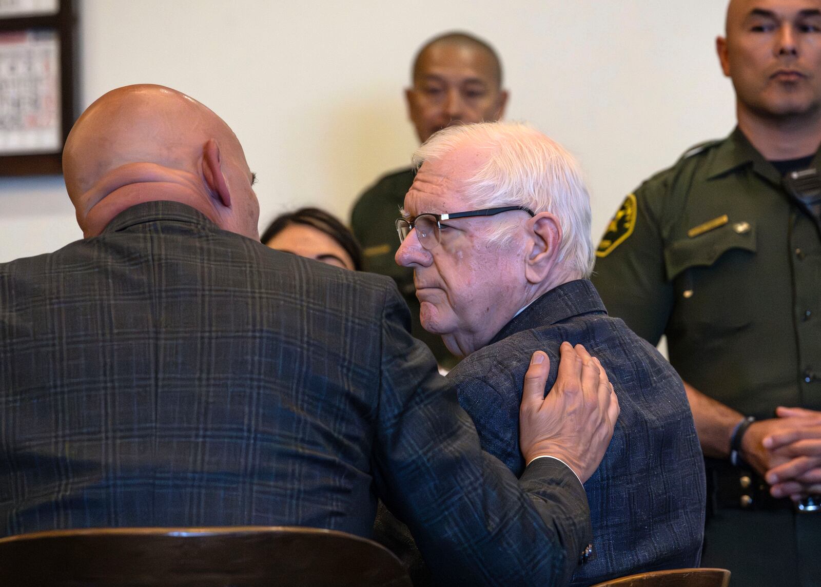An Orange County Superior Court jury found Orange County Superior Court Judge Jeffrey Ferguson guilty of second-degree murder in the 2023 shooting death of his wife Sheryl Ferguson, is consoled by his attorney, Cameron Talley, after the verdict was read Tuesday, April 22, 2025, in Santa Ana, Calif. (Mindy Schauer/The Orange County Register via AP, Pool)