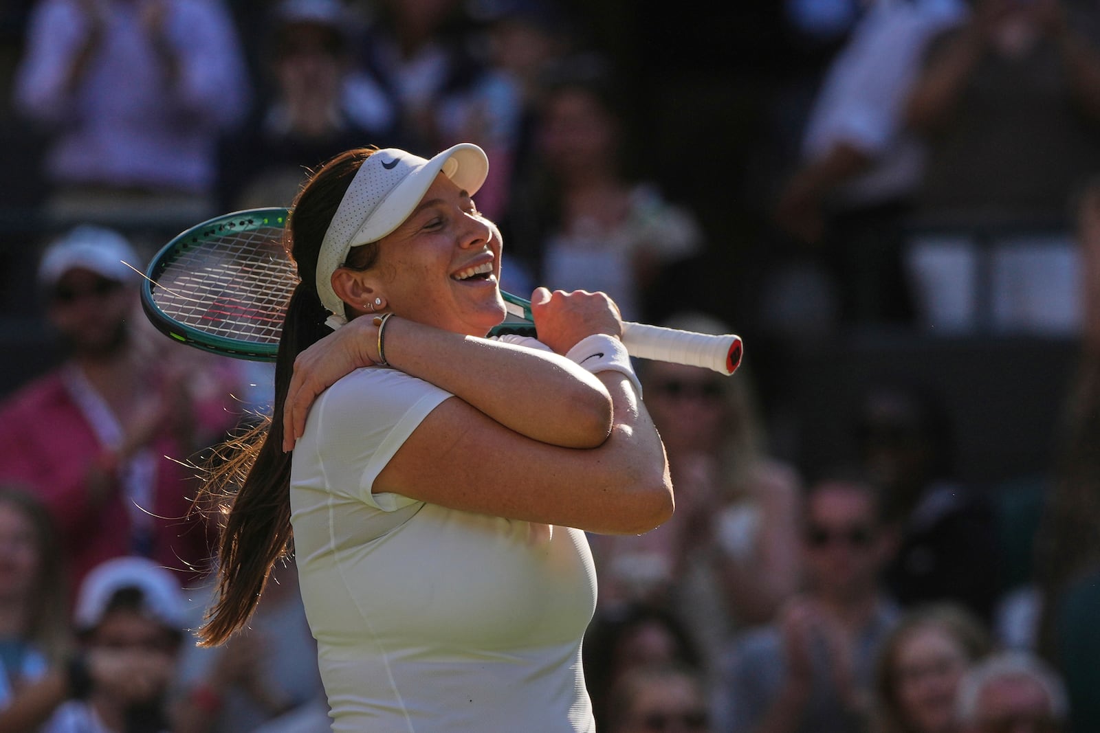 Amanda Anisimova of the U.S. celebrates winning the women's singles quarter finals match against Anastasia Pavlyuchenkova of Russia at the Wimbledon Tennis Championships in London, Tuesday, July 8, 2025.(AP Photo/Kin Cheung)