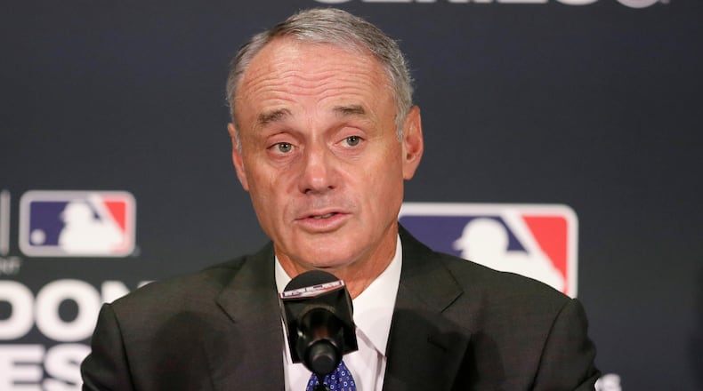 FILE - Major League Baseball commissioner Rob Manfred speaks during a news conference, June 29, 2019, in London. (AP Photo/Tim Ireland, file)