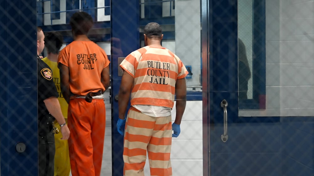 Butler County Sheriff Richard Jones has taken a hard stance on immigration since taking office more than two decades ago. He had 10 deputies credentialed to serve as ICE agents in the county, and said he plans to have more deputies eventually go through the training. Pictured are inmates on Wednesday, July 9, 2025, entering a pod to assist in cleaning. MICHAEL D. PITMAN/STAFF