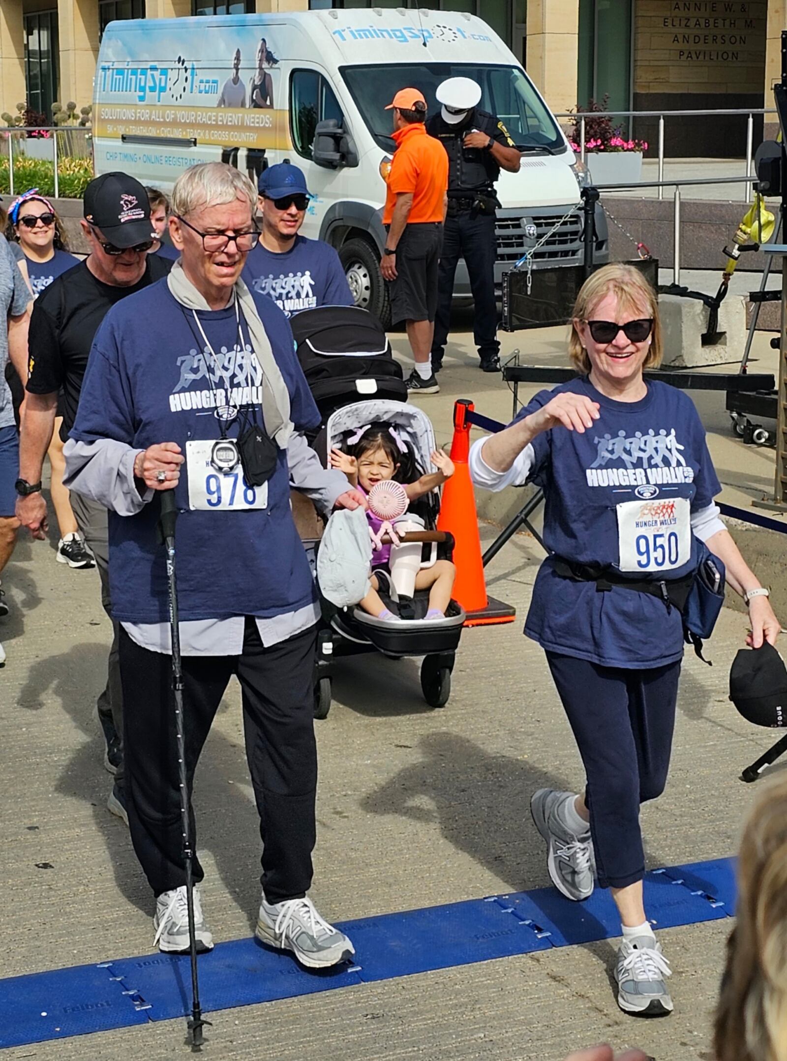 Dale Brown, 75, of Middletown, and his girlfriend, Ruth Blom, cross the finish line of the 3.1-mile Hunger Walk in Cincinnati. SUBMIITTED PHOTO