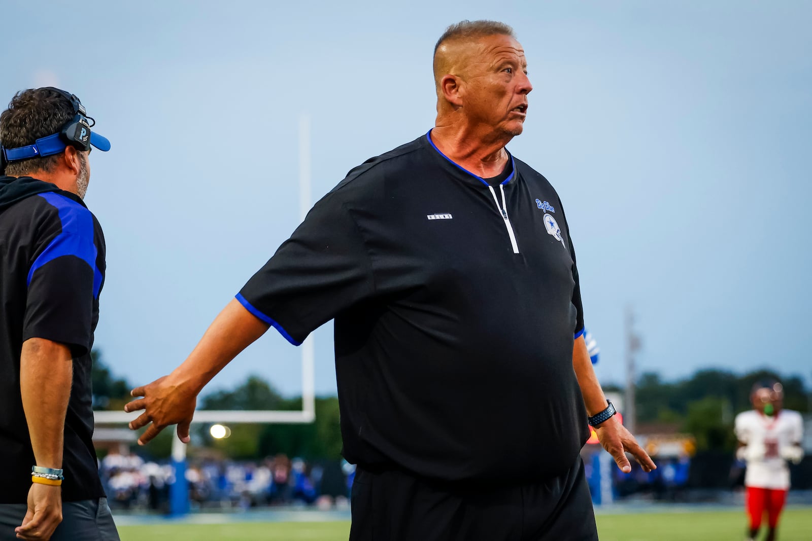 Hamilton head football coach Arvie Crouch expresses his concerns to the referee during their game Friday, Sept. 5, 2025 at Virgil Schwarm Stadium in Hamilton. Lakota West won 38-6. NICK GRAHAM/STAFF