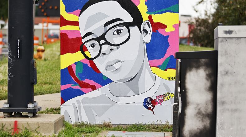 "Changing the World Through Art - One Kid at a Time" is a mural painted as part of the Hamilton StreetSpark program. NICK GRAHAM / STAFF