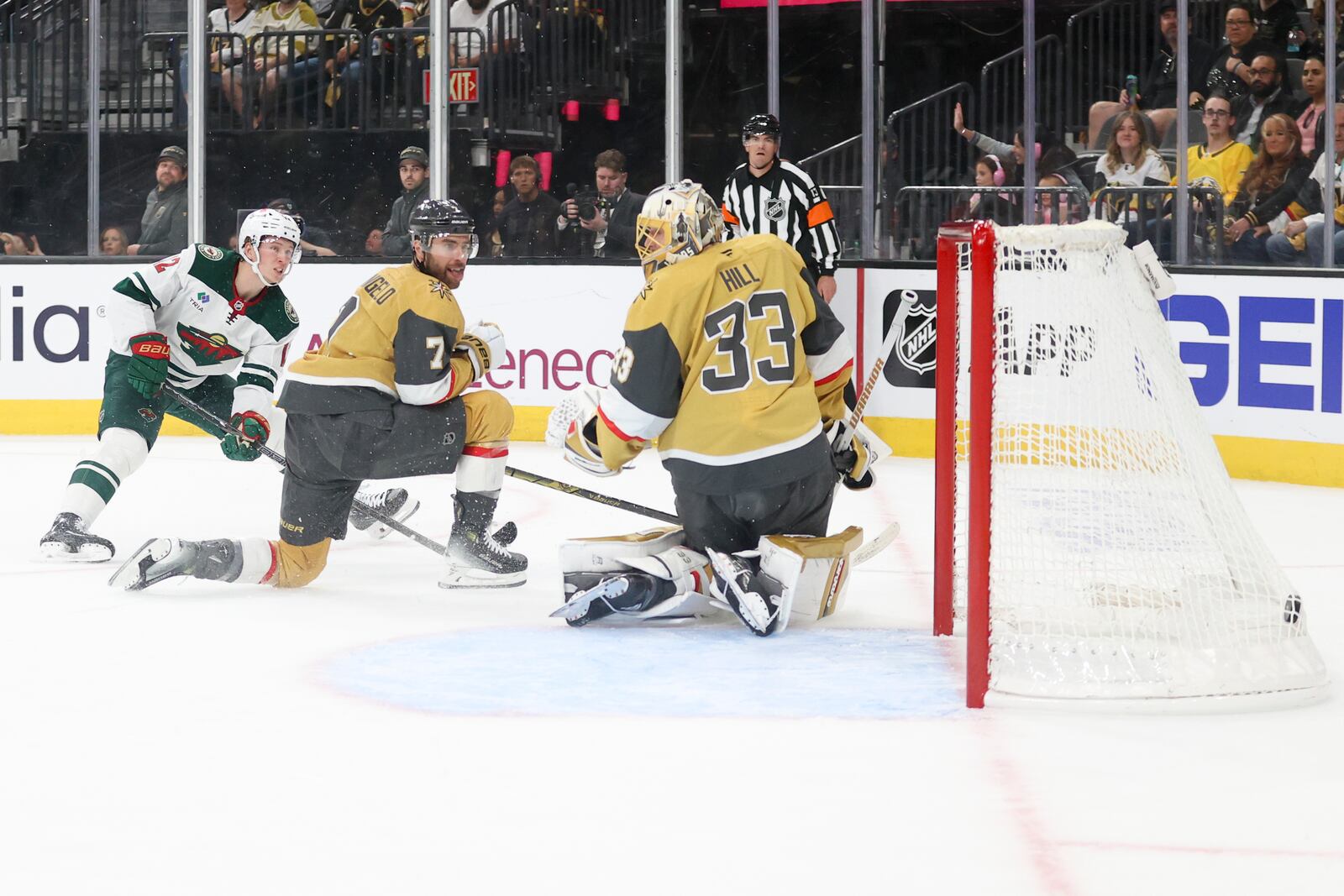 Minnesota Wild left wing Matt Boldy (12) scores a goal past Vegas Golden Knights defenseman Alex Pietrangelo (7) and goaltender Adin Hill (33) during the first period in Game 1 of an NHL hockey Stanley Cup first-round playoff series Sunday, April 20, 2025, in Las Vegas. (AP Photo/Ian Maule)