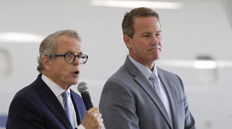 Ohio Gov. Mike DeWine and Lt. Gov. Jon Husted. TY GREENLEES / STAFF