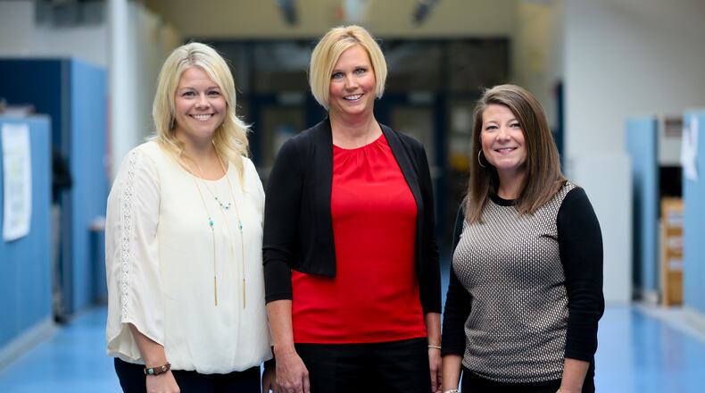 Butler County JFS Executive Director Bill Morrison says his seconds in command, Shannon Glendon (left) and Julie Gilbert (right) have been the architects of true reform at the agency he told the commissioners. GREG LYNCH / STAFF