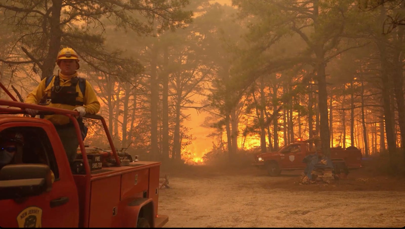 Smoke fills the sky as firefighters battle a wildfire in Lacey Townships, N.J. on Tuesday, April 22, 2025. (New Jersey Department of Environmental Protection via AP)