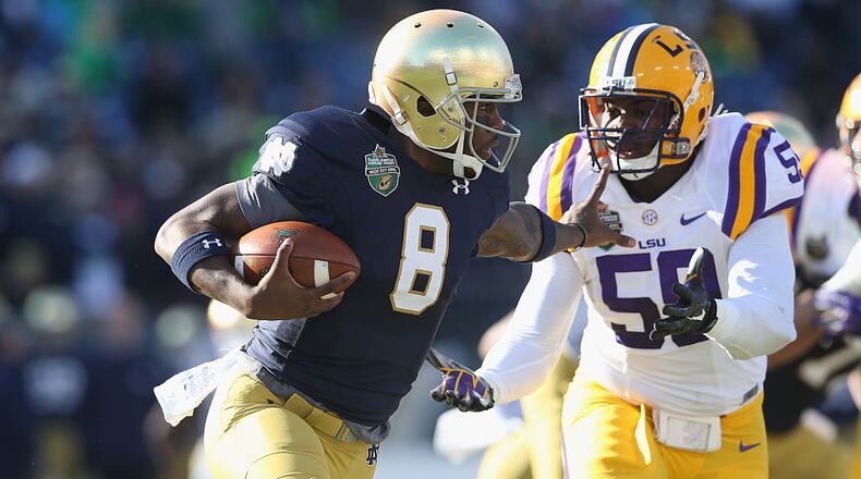 NASHVILLE, TN - DECEMBER 30: Malik Zaire #8 of the Notre Dame Fighting Irish runs with the ball against the LSU Tigers during the Franklin American Mortgage Music City Bowl at LP Field on December 30, 2014 in Nashville, Tennessee. (Photo by Andy Lyons/Getty Images)