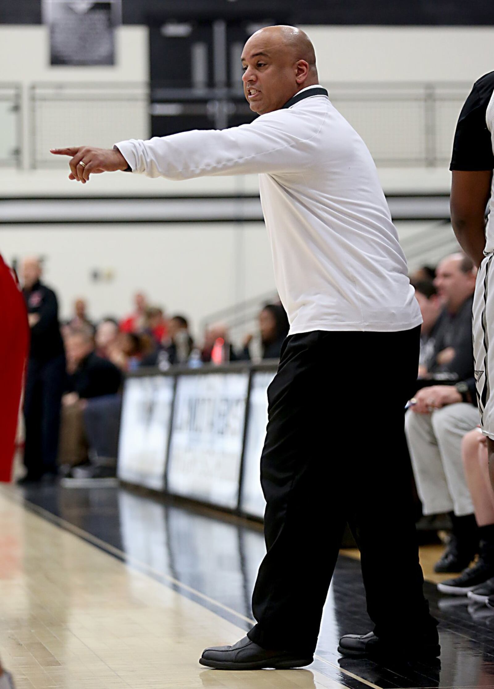 Lakota East coach Gideon Dudgeon makes a call during Wednesday night’s game against visiting Lakota West. CONTRIBUTED PHOTO BY E.L. HUBBARD
