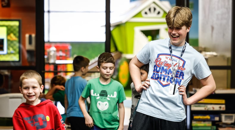 In this file photo, Washington Twp. Rec West camp counselor, Daniel Webster works with children ages 5-11 years old at the center on Monday March 28, 2022. JIM NOELKER/STAFF