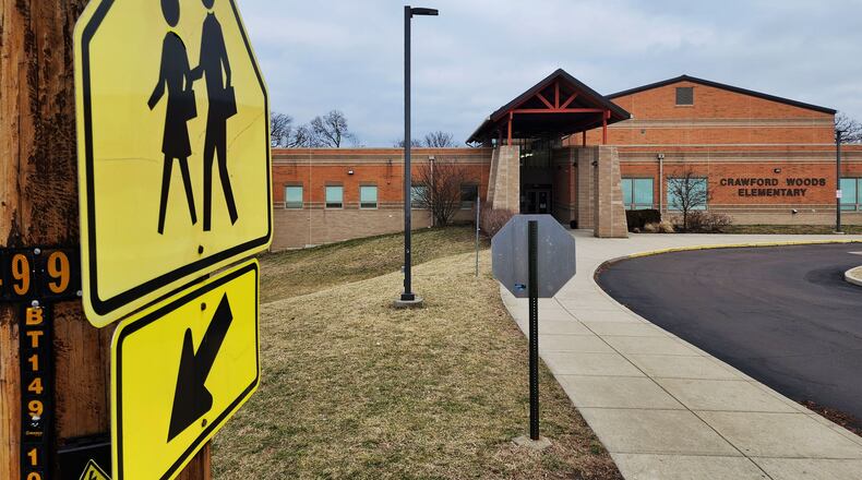 The city on Hamilton will seek a grant from ODOT's Safe Routes to School Grant Program for infilling sidewalks and installing ADA compliant curb ramps, crosswalks, and signage around Crawford Woods Elementary School. NICK GRAHAM/STAFF