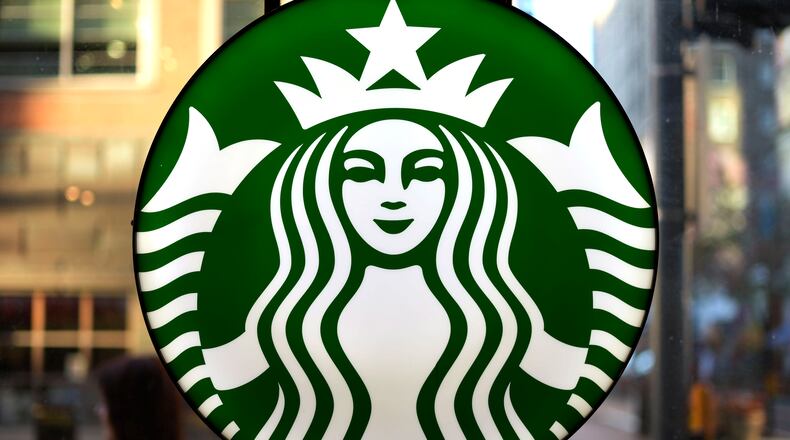 FILE - The Starbucks logo is displayed in the window of a downtown Pittsburgh Starbucks on Monday, Nov. 7, 2022. (AP Photo/Gene J. Puskar, File)