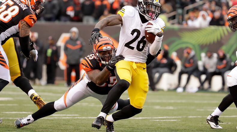 Bengals linebacker Vontaze Burfict,  seen here tackling Steelers refugee/holdout running back Le'Veon Bell last season at Paul Brown Stadium on December 18, doesn't like Pittsburgh. Those folks don't like him much, either, apparently.
