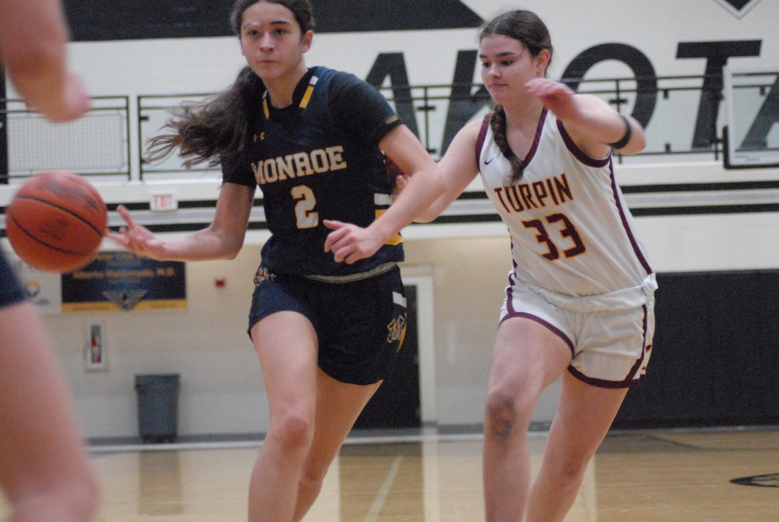 Monroe's Paityn Corthell is guarded by Turpin's Ella Putnam on Wednesday night. Chris Vogt/CONTRIBUTED