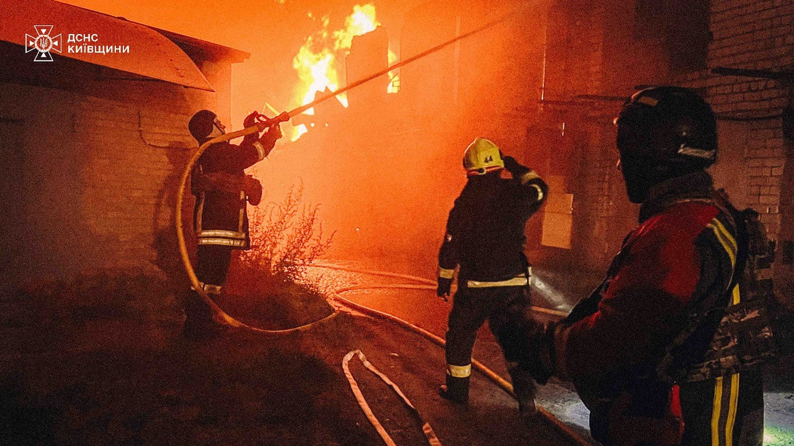 In this photo provided by the Ukrainian Emergency Service, first responders work to extinguish a fire following a Russian attack in Kyiv region, Ukraine, Friday, July 4, 2025. (Ukrainian Emergency Service via AP)