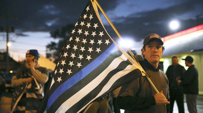 Community policing has been in the news throughout the year because of violence toward police officers and the number of unarmed black men shot by police officers. (E. Jason Wambsgans/Chicago Tribune via AP)