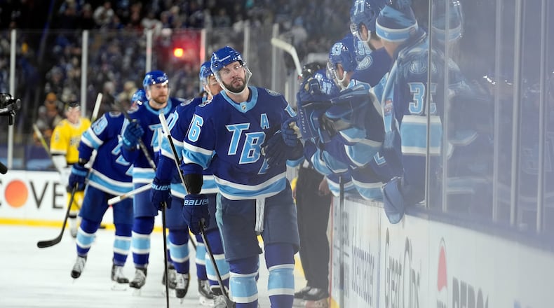 Tampa Bay Lightning right wing Nikita Kucherov (86) celebrates with the bench after his goal against the Boston Bruins during the thirdd period of a Stadium Series NHL hockey game Sunday, Feb. 1, 2026, in Tampa, Fla. (AP Photo/Chris O'Meara)