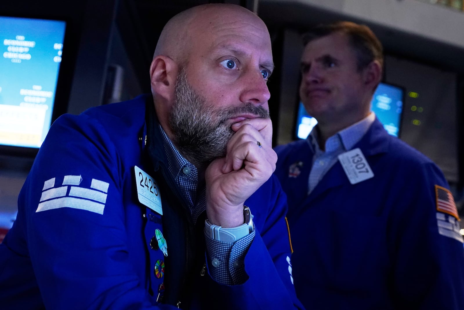Specialist Meric Greenbaum, left, works at his post on the floor of the New York Stock Exchange, Thursday, April 17, 2025. (AP Photo/Richard Drew)