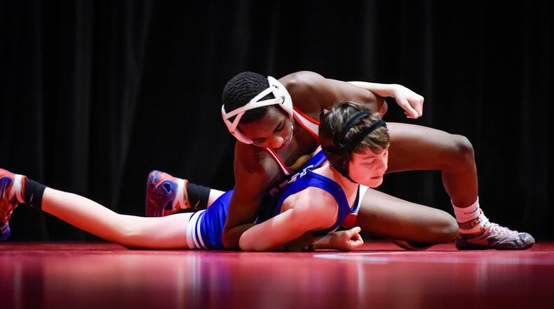 Fairfield’s Moustapha Bah is en route to a 106-pound victory over Springboro’s Michael Gust during a dual Jan. 19 at Fairfield’s Performing Arts Center. NICK GRAHAM/STAFF