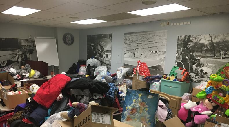 Butler County residents donated gifts that filled a Middletown Division of Police training room. The gifts were donated to nine children whose mother may have overdosed, and the extra presents were given to other children in need, said Police Chief Rodney Muterspaw. RICK McCRABB/STAFF