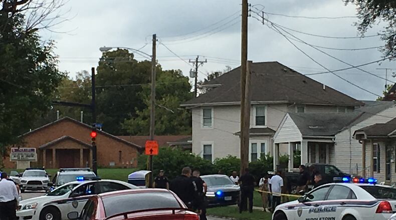 Middletown police investigating the scene of a shooting on 14th Avenue. RICK MCCRABB/STAFF