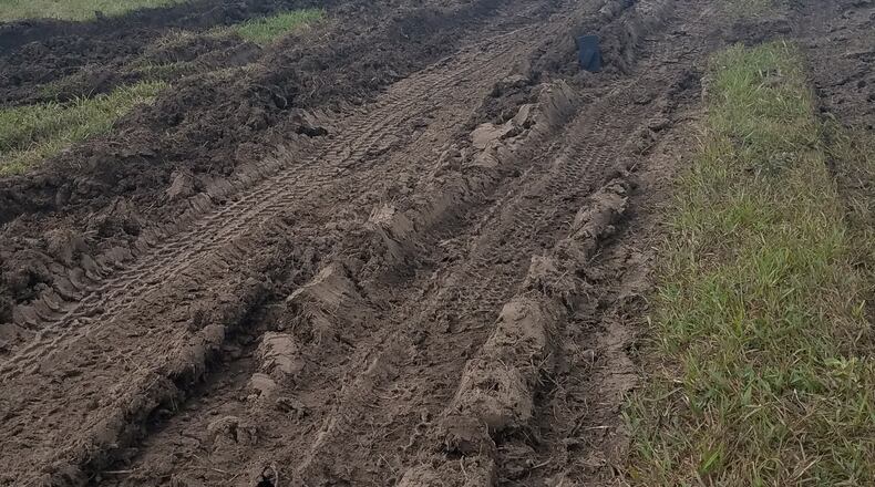 Buses used to shuttle Ohio Challenge attendees to and from the event left these ruts along a taxiway drainage ditch at Middletown Regional Airport, according to the city.