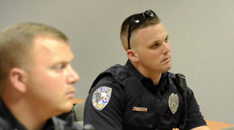 Fairfield Twp. is building its police force to its authorized strength of 23. The township aims to hire two additional officers the first week of February to meet that authorized strength level. Pictured are officers during roll call in July 2019. MICHAEL D. PITMAN/FILE