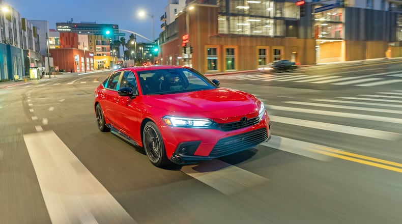 This undated photo provided by Honda shows the 2022 Honda Civic, which is the Edmunds Top Rated Sedan. It has more subdued styling in its current 11th generation and offers an exceptionally quiet cabin alongside a rich set of features. (Courtesy of American Honda Motor Co. via AP)