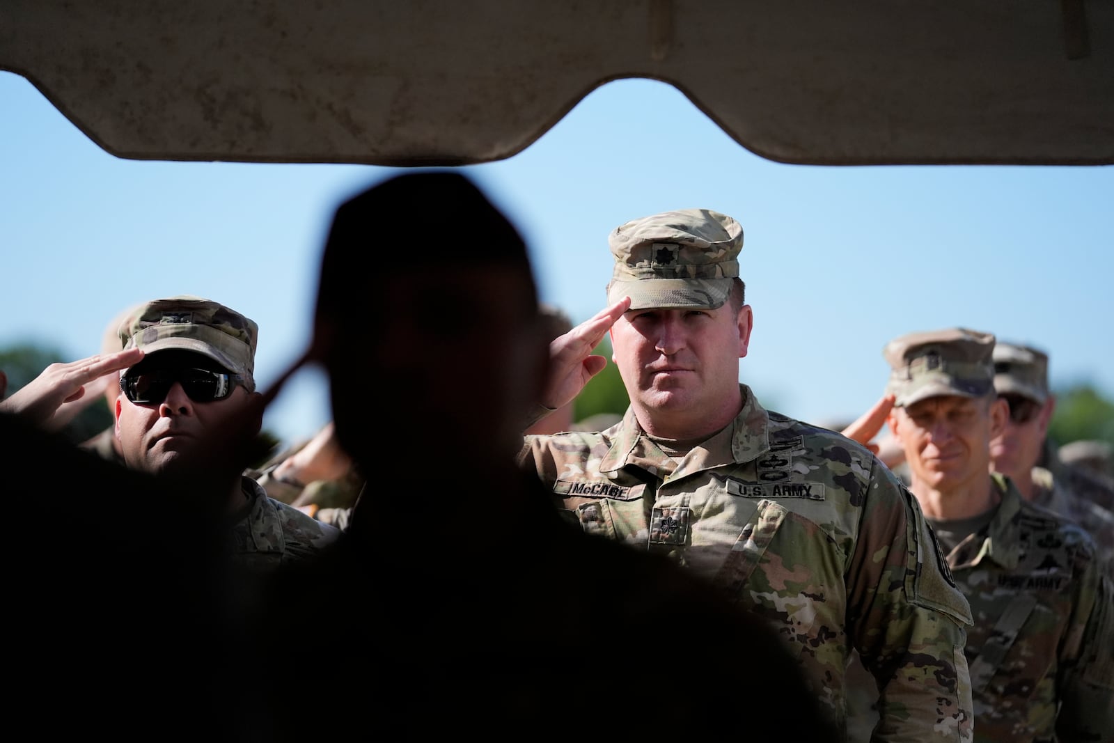Members of the Army military salute during a ceremony at Fort Benning, honoring new namesake of World War I Fred Benning on Wednesday, April 16, 2025, in Fort Benning, Ga. (AP Photo/Brynn Anderson)