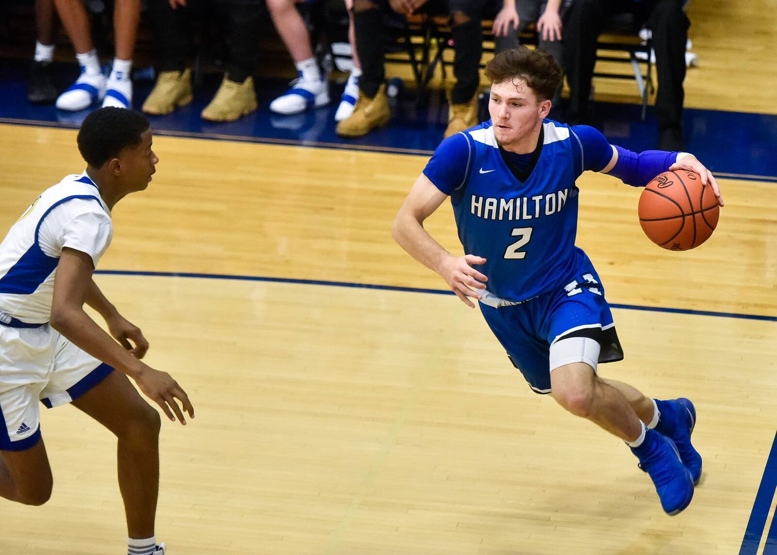 Hamilton’s Kurtis Reid drives toward the hoop Friday night during a 58-52 road triumph over Northwest. NICK GRAHAM/STAFF